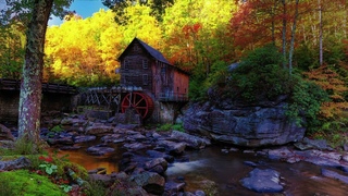 GOLDEN OCTOBER OVER THE OLD MILL OF A BURBLING ROCKY RIVER  GENTLY RELAXING AND SOOTHING